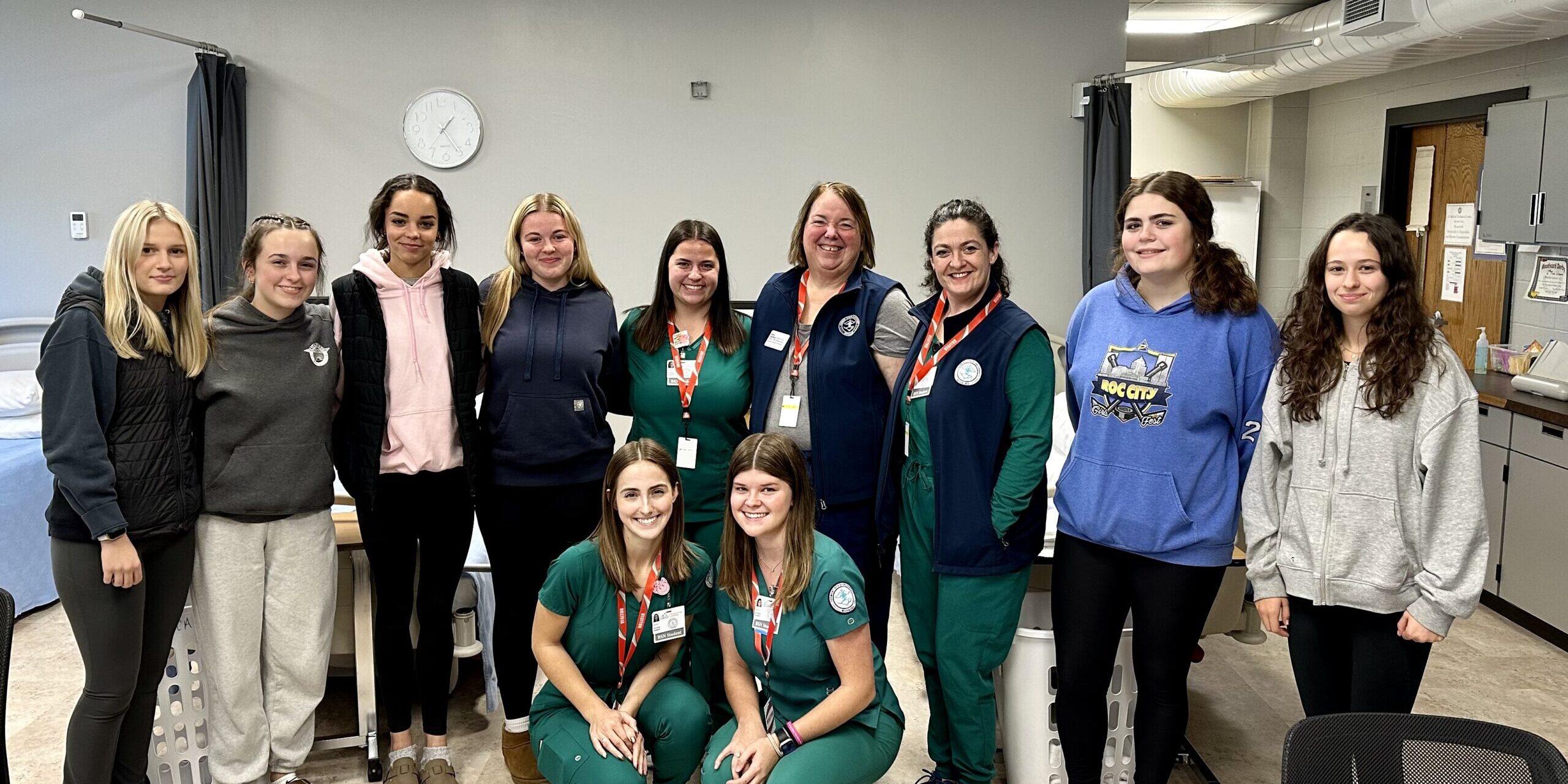 Stafford Health students surround visiting college nursing students