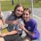 Two students are smiling as they pose for the camera