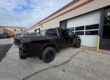 A black truck gleaming with a very clean look