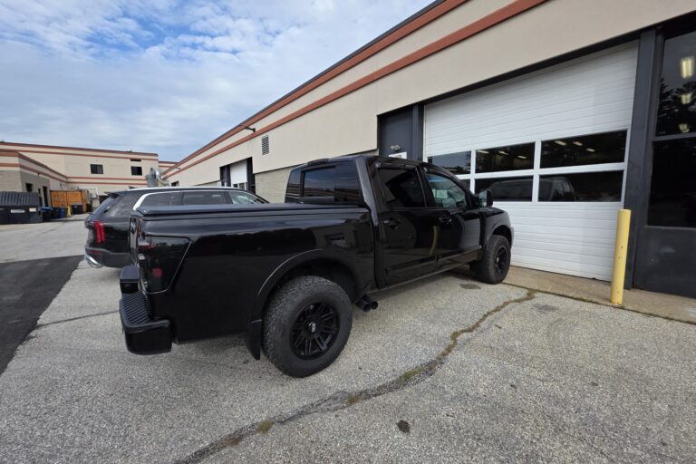 A black truck gleaming with a very clean look