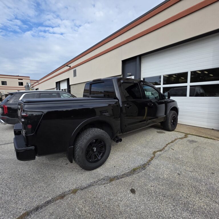 A black truck gleaming with a very clean look