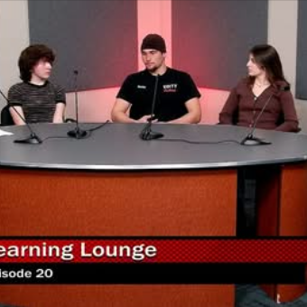 four students sit with one adult at a round table